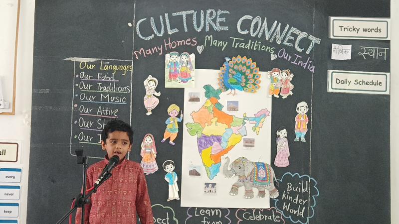 A boy presents in front of the Culture Connect board